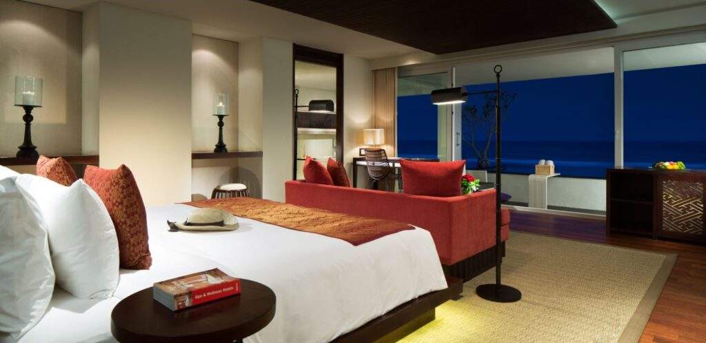 large resort bed with large picture windows