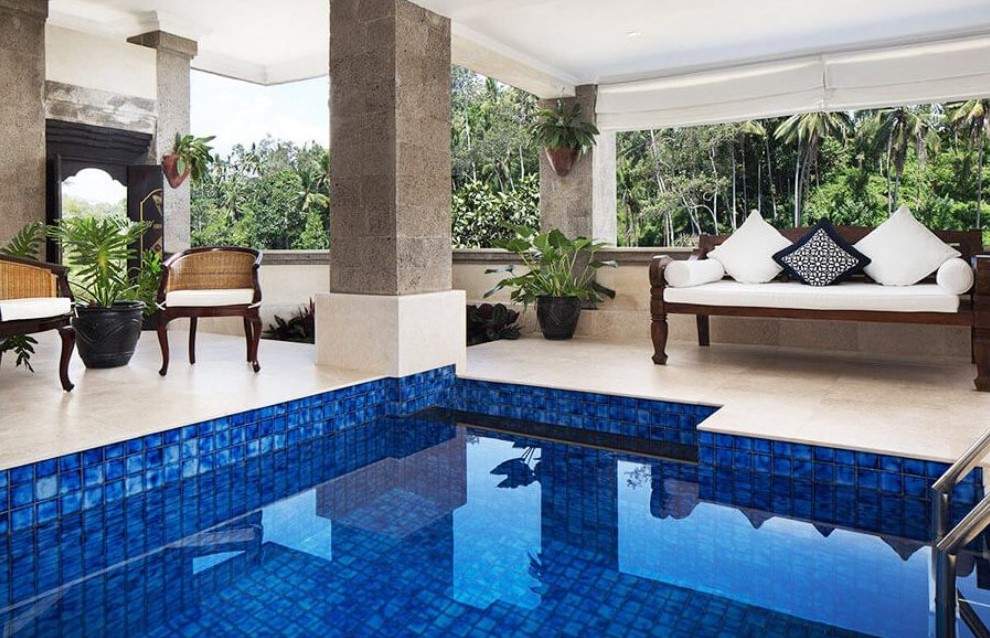 pool surrounded by chairs