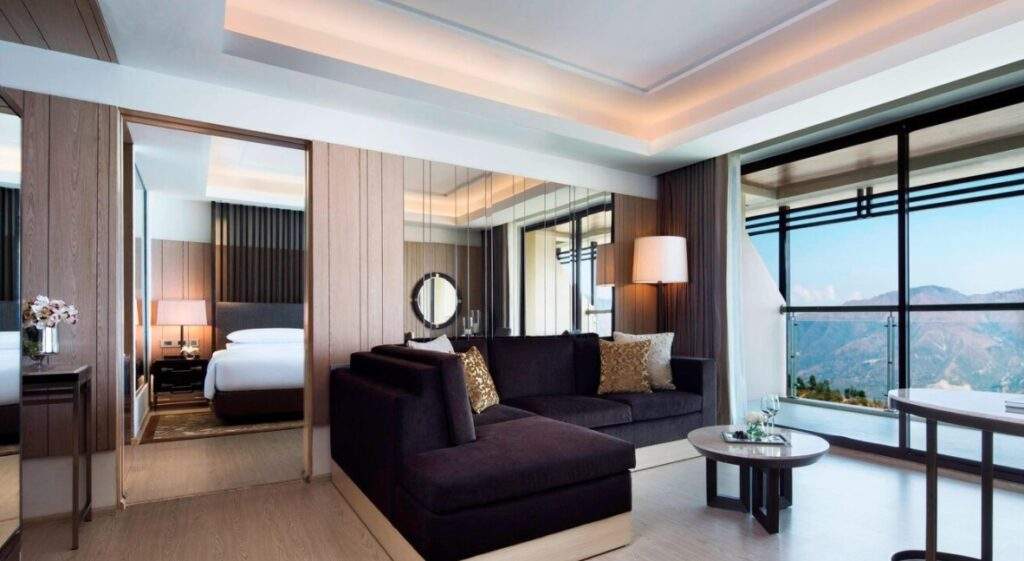 two brown couches in front of large window