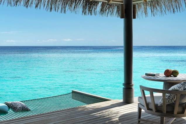 pool under umbrella overlooking ocean