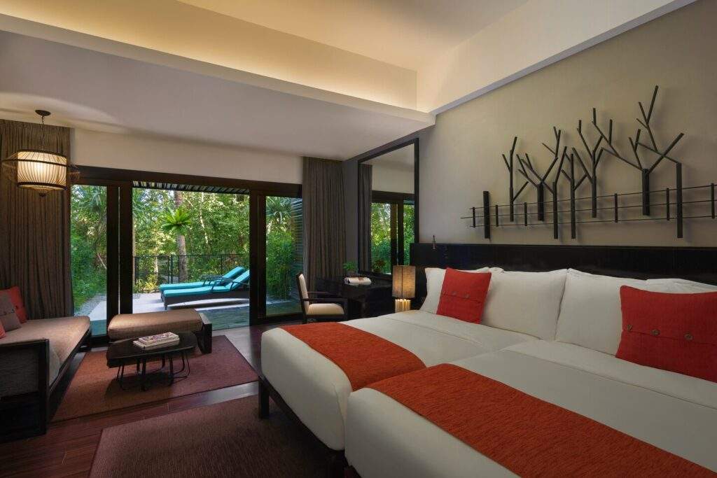white bed with red pillows