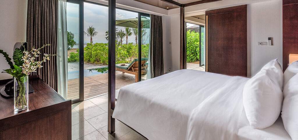 white bed look out at forest