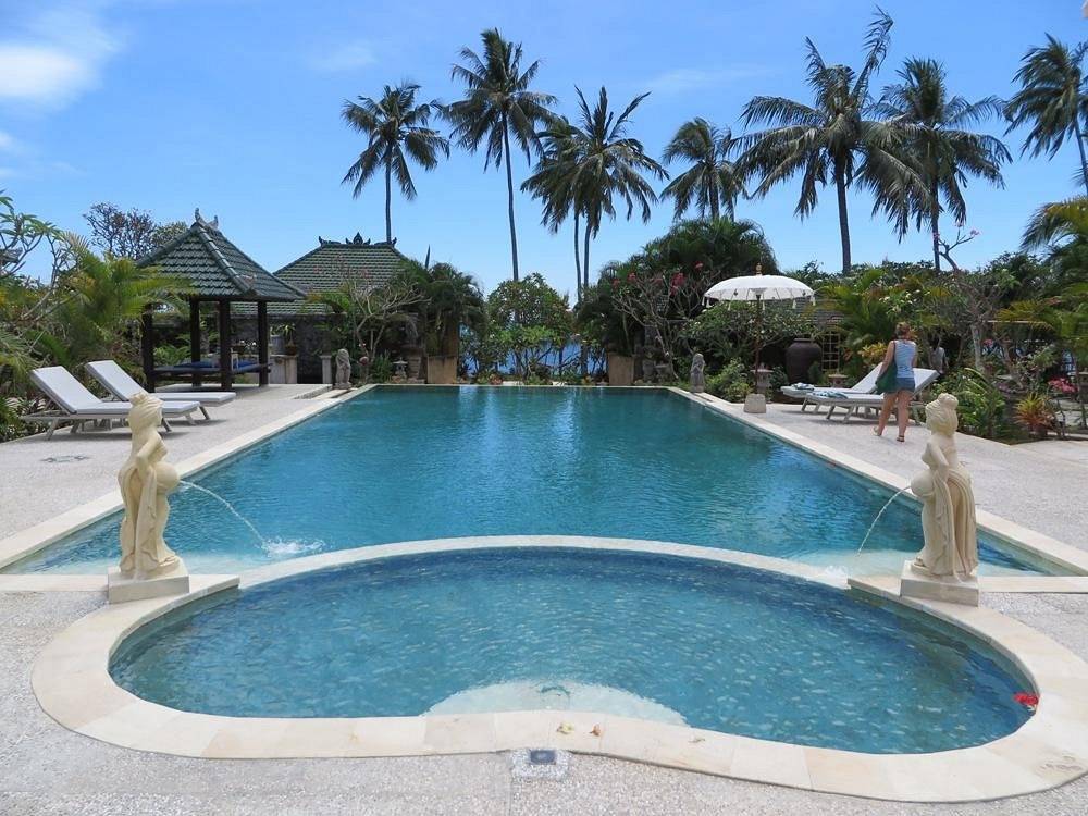 large pool attached to hot tub in the tropics