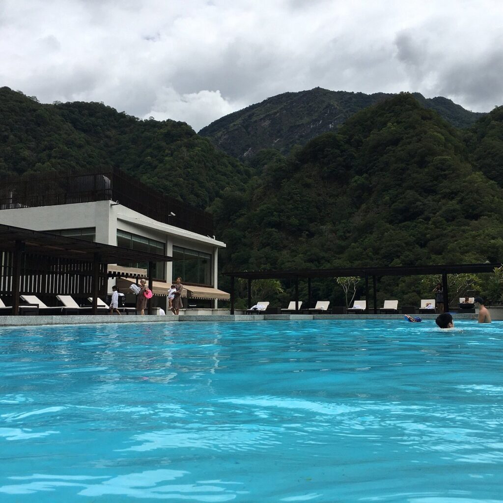 huge resort pool with mountains in background