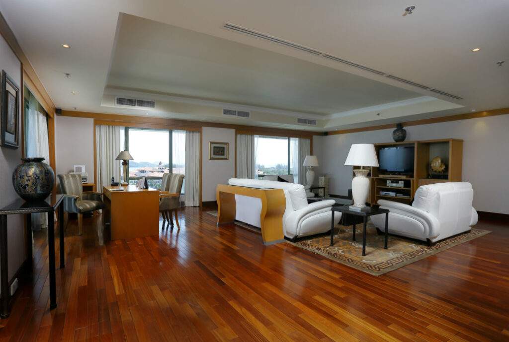 large open resort room with two white couches