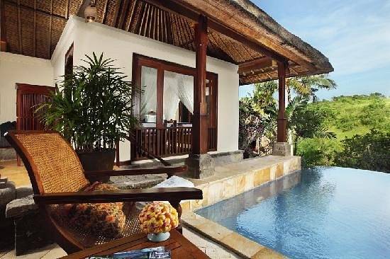 resort villa with pool and lounge chair