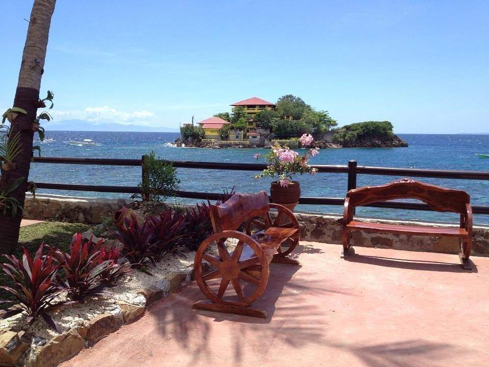 deck overlooking ocean with island in background