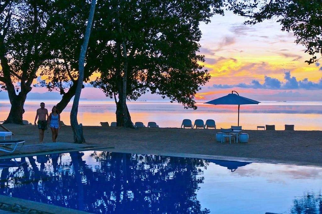 pool in front of ocean at sunset
