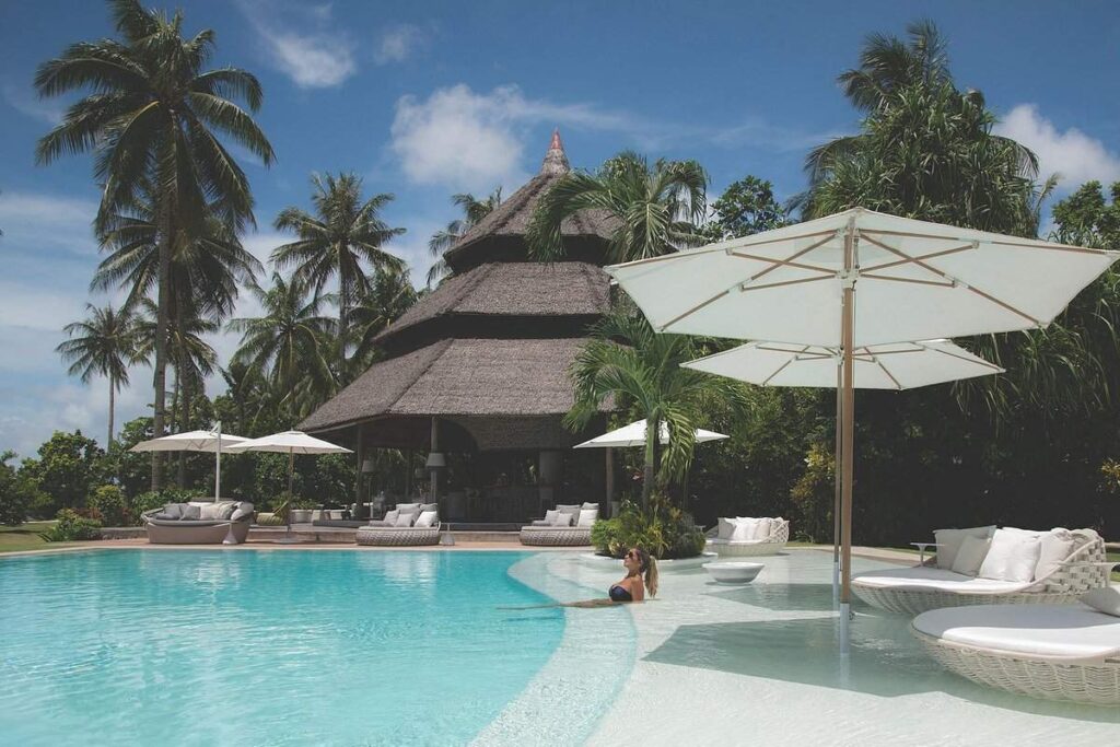 resort pool with building in background