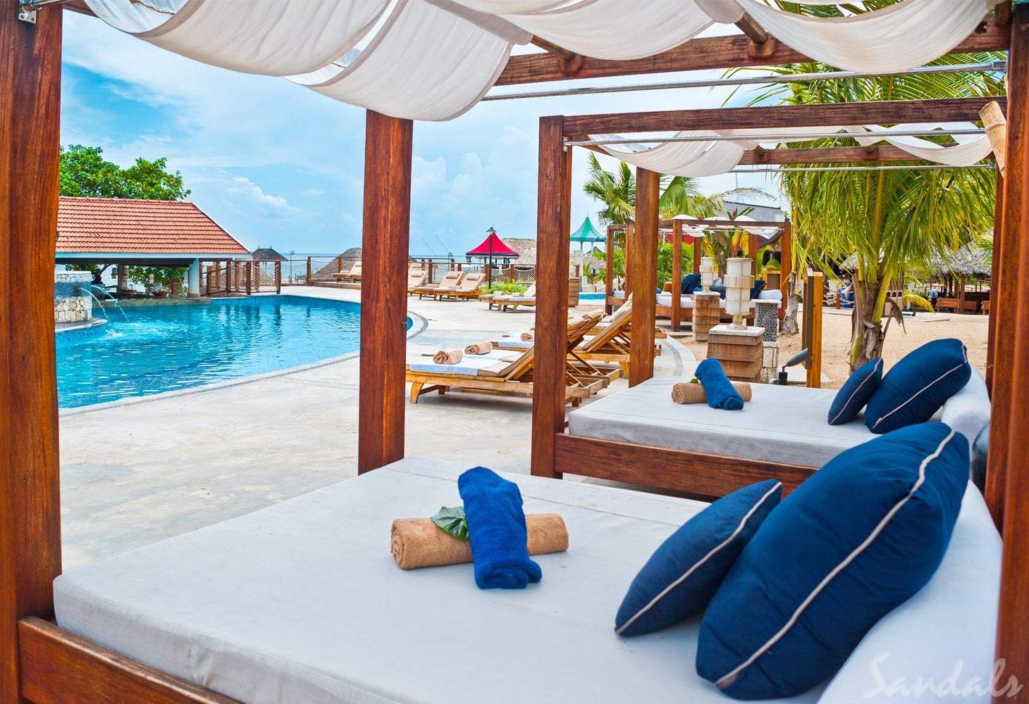 multiple cabanas in front of pool