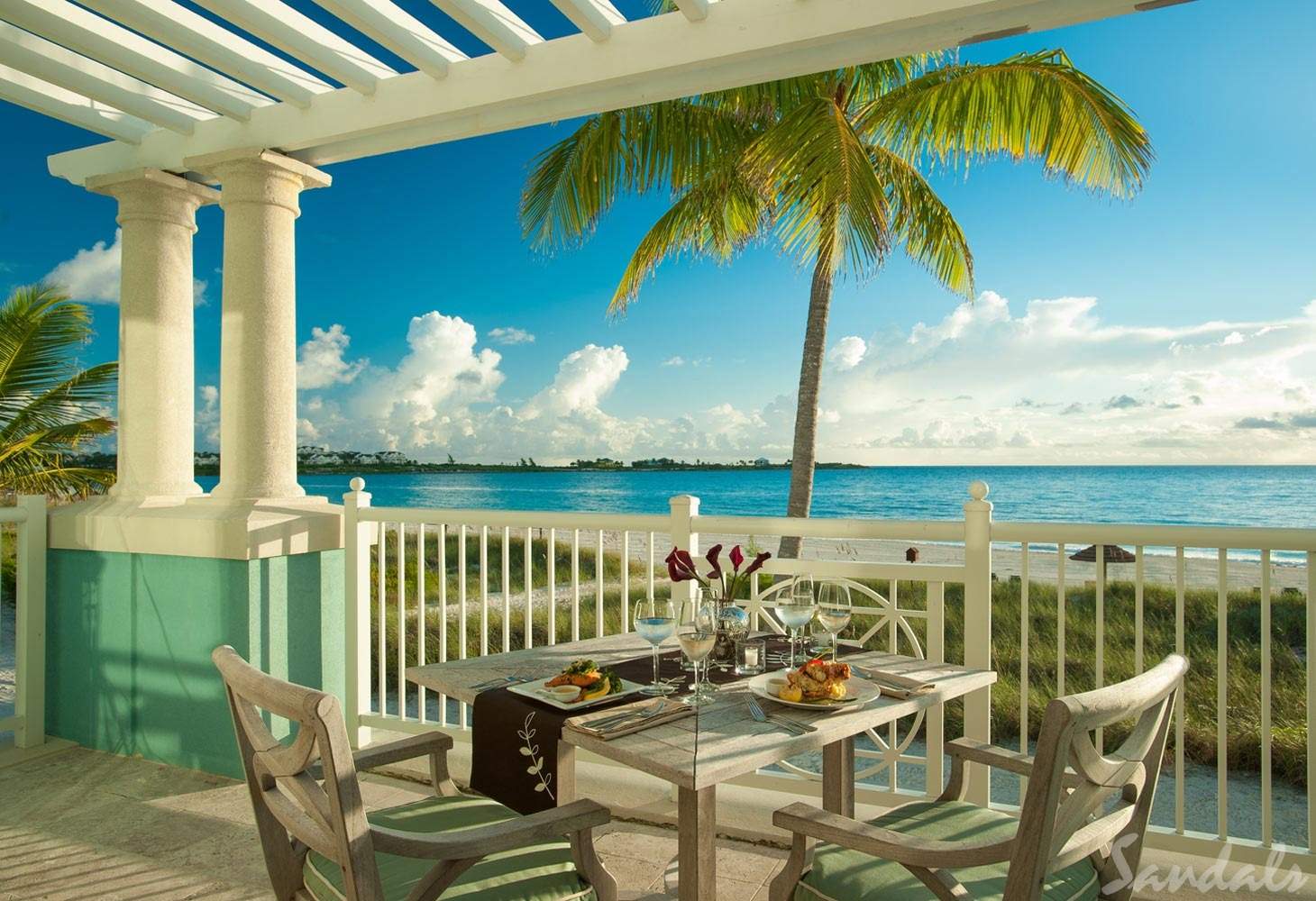 resort patio dinner table in front of ocean