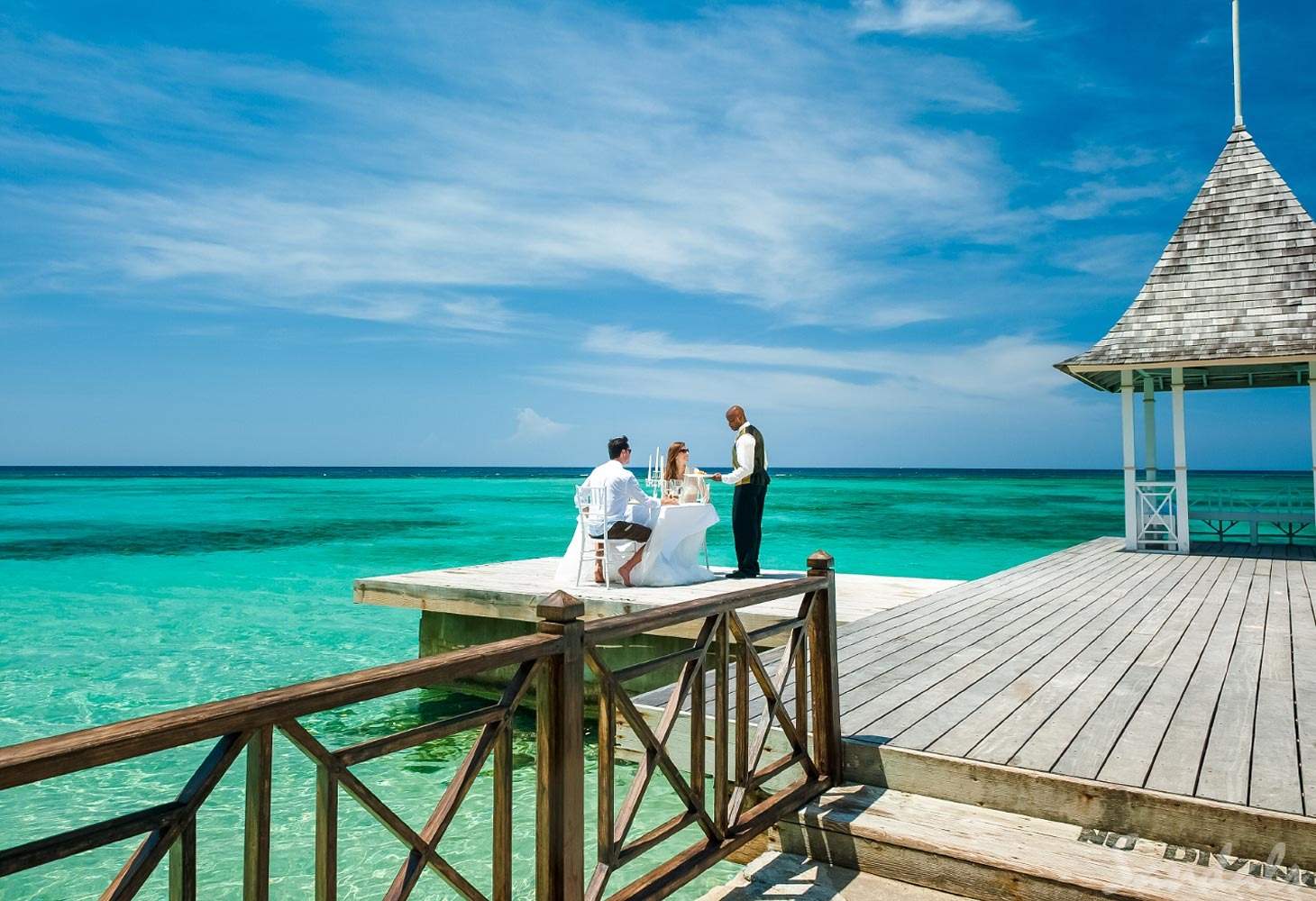 couple at table on over-water patio