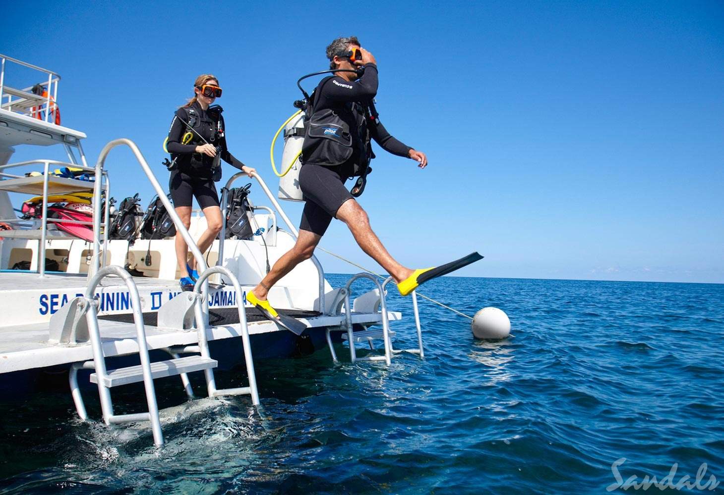 two people scuba diving