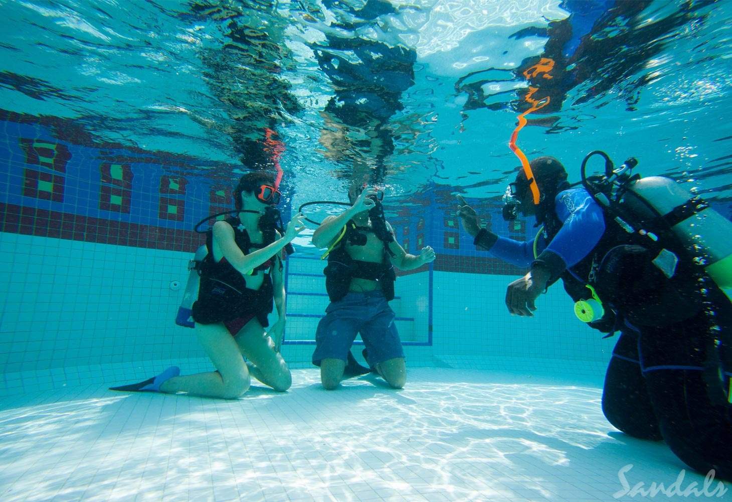 two people getting scuba diving instruction