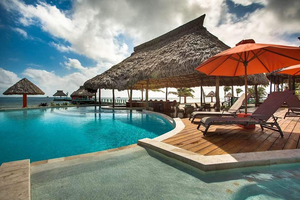 curved resort pool with large covered area