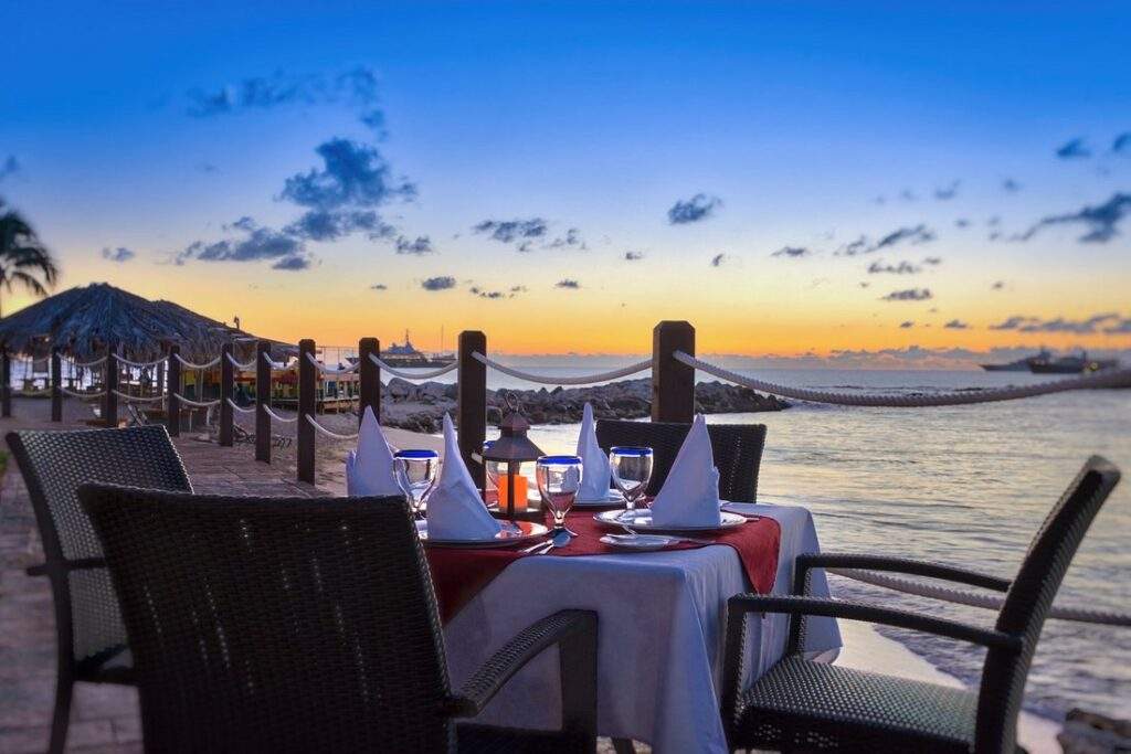 dinner table on the beach at sunset