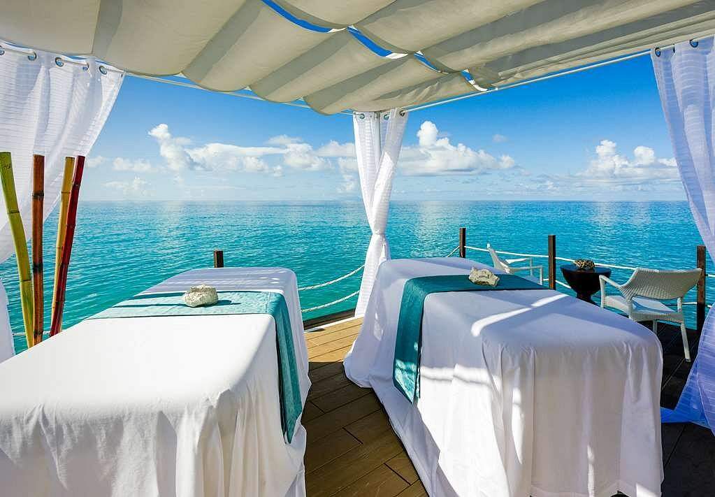 two spa tables facing the ocean