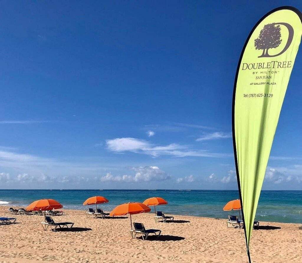 beach with orange umbrellas