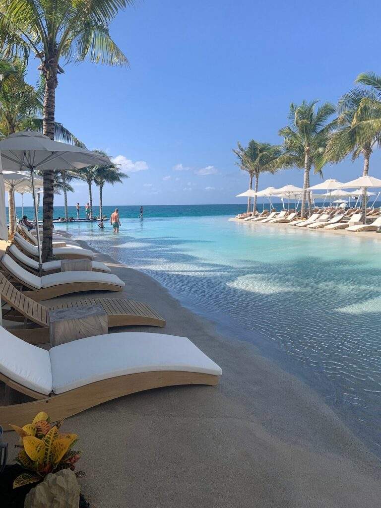 lounge chairs next to resort pool