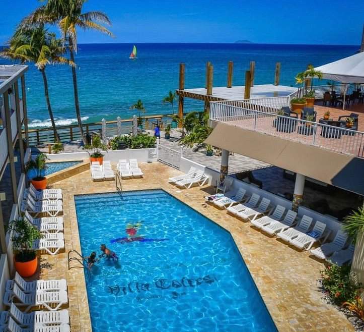 large resort pool in front of ocean