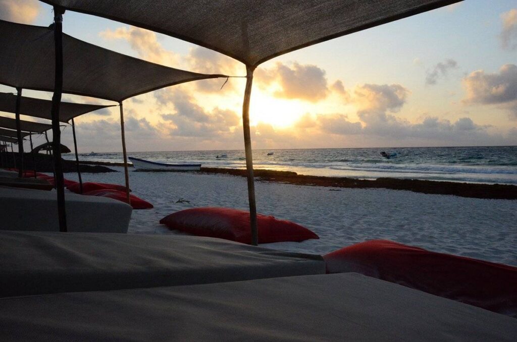 sun setting over beach