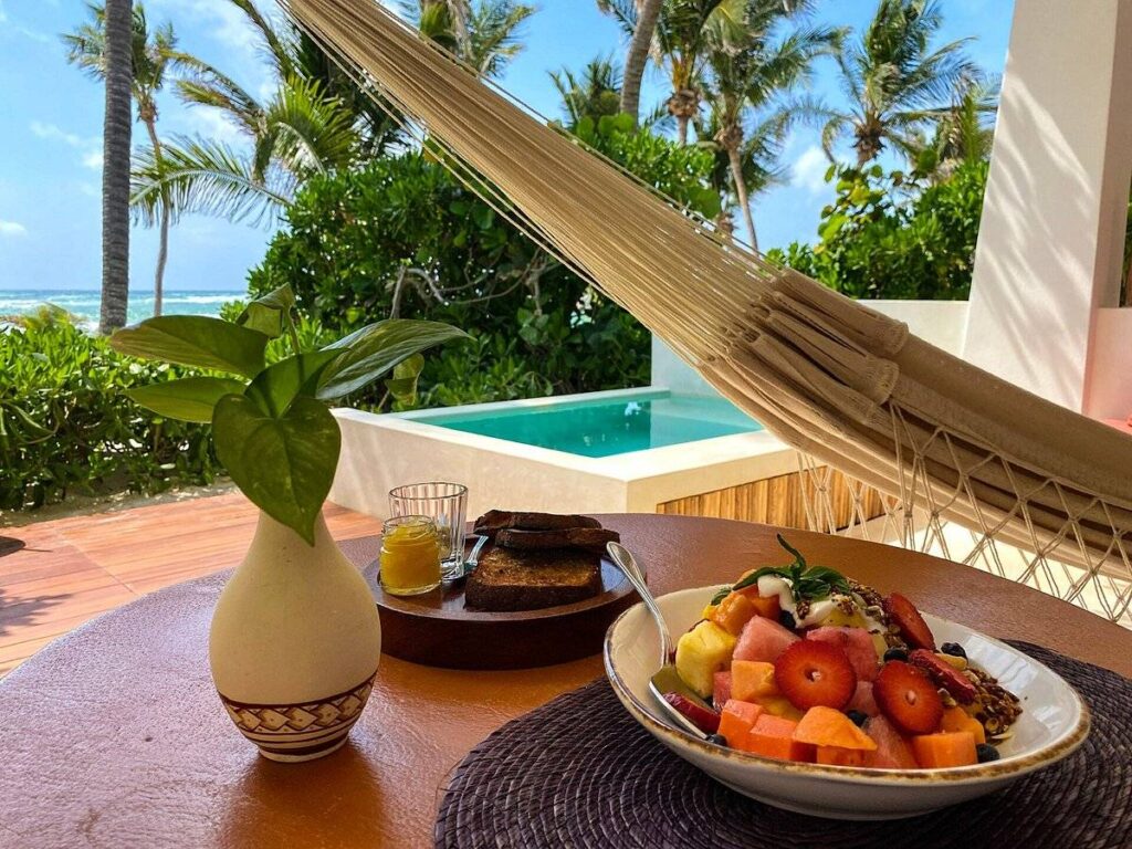 fruit on resort patio table with private pool