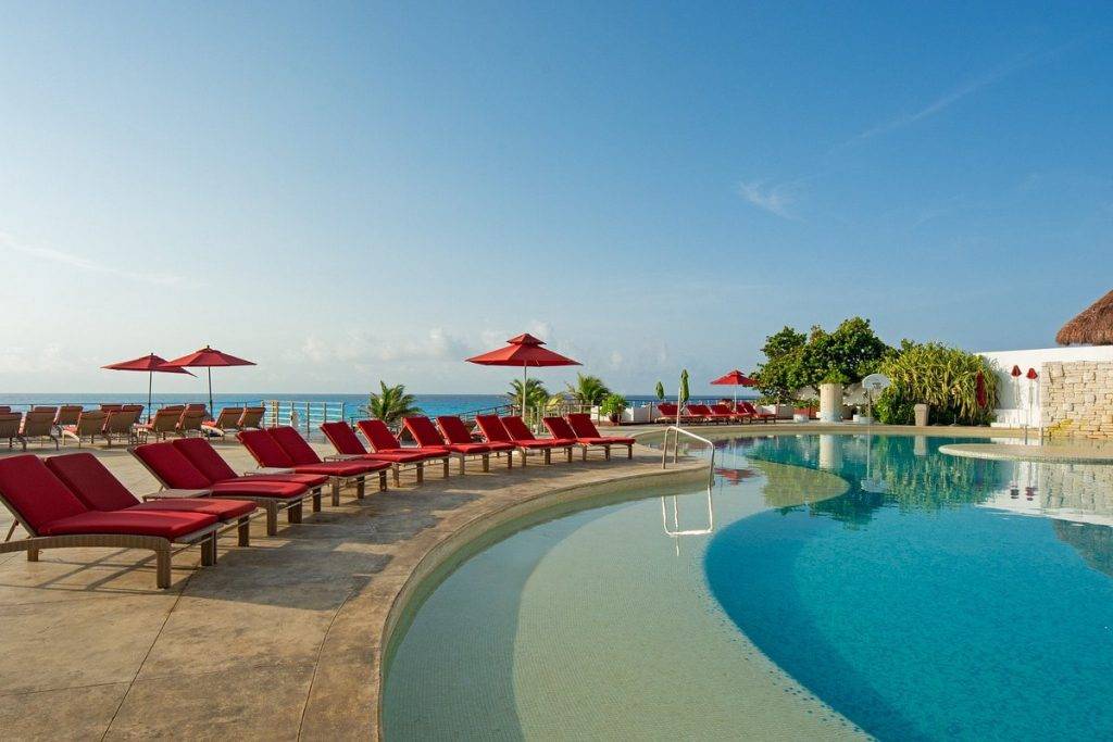 red chairs around resort pool