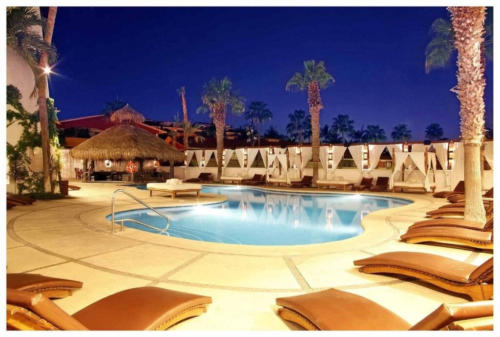 deck chairs around pool at night