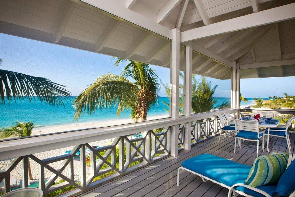 long porch along beach with lounge chairs
