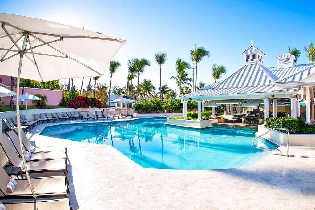 resort pool surrounded by patio chairs