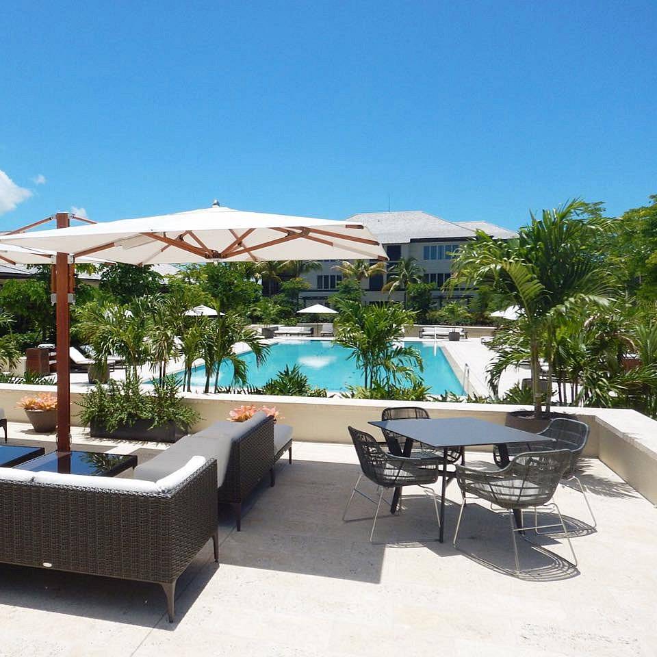 lounge furniture above resort swimming pool