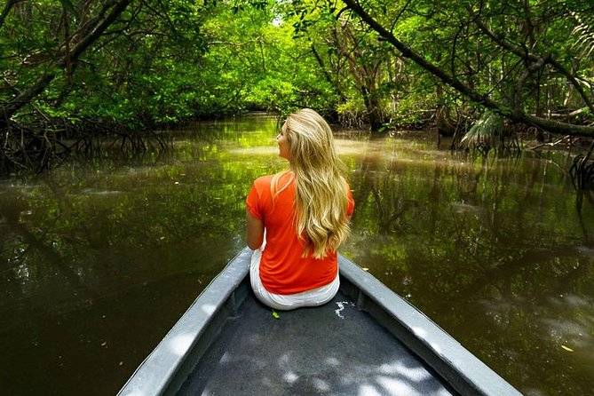 woman in boat floating on river