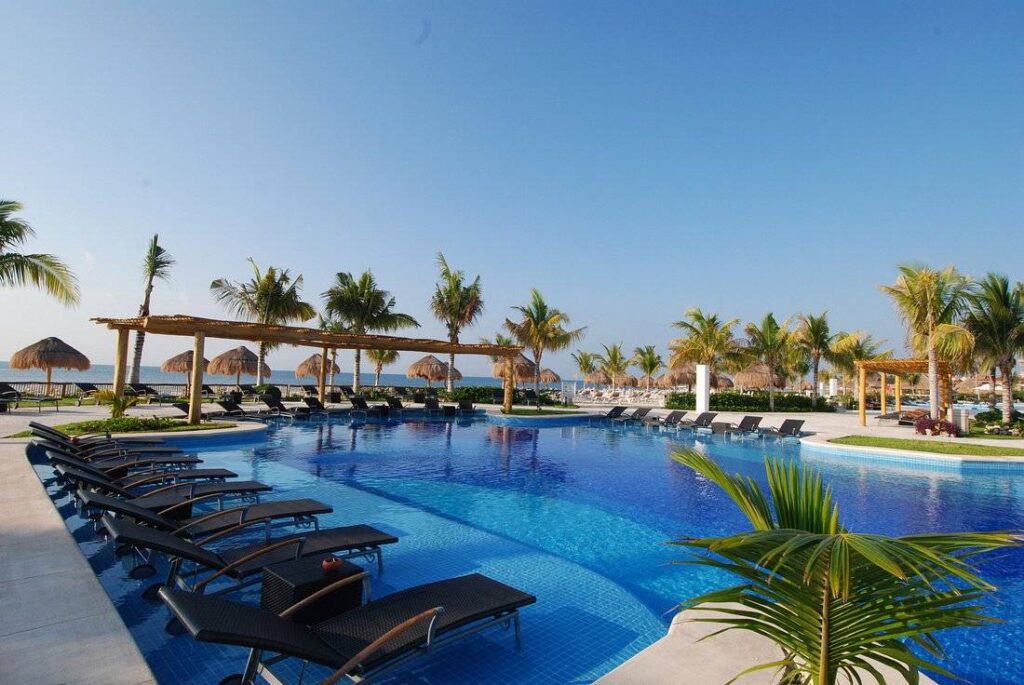 tropical resort pool with palm trees