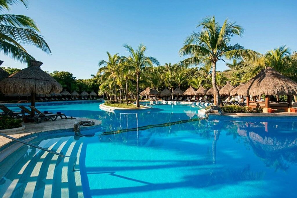 large resort pool with palm trees