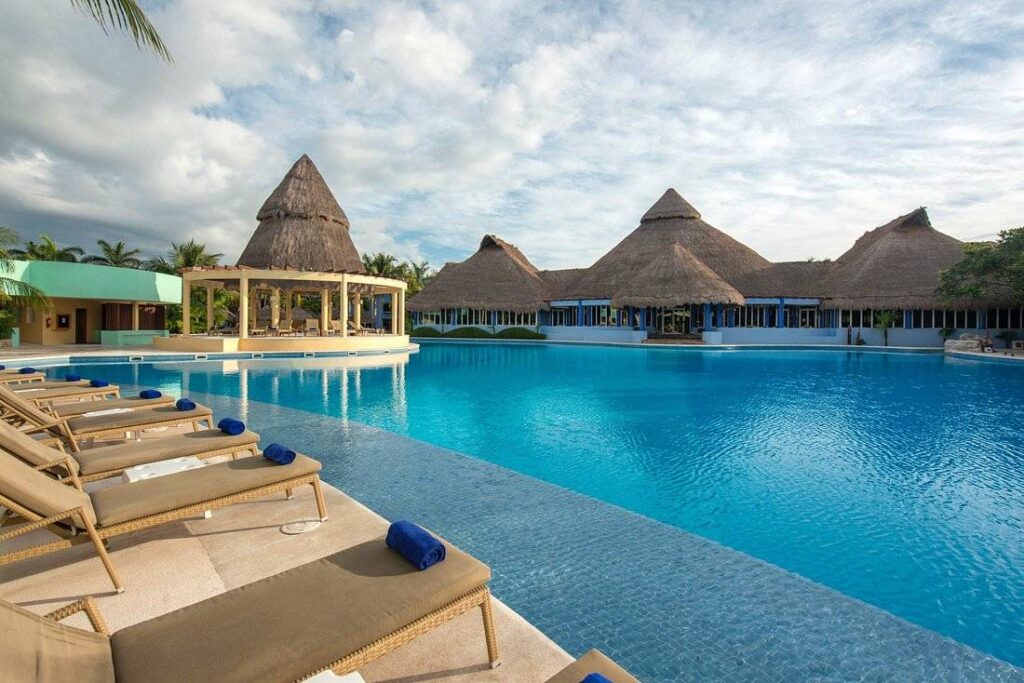 large  resort pool surrounded by lounge chairs