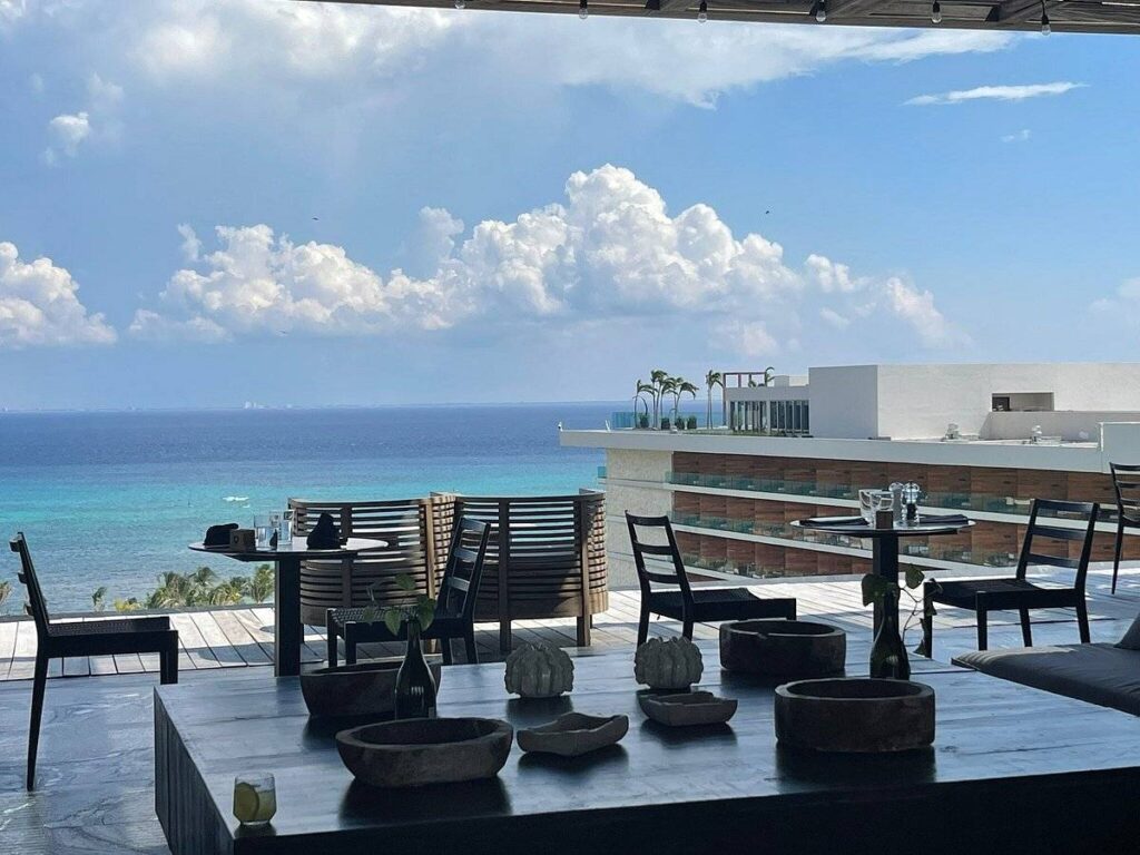 dining tables on covered patio at the beach