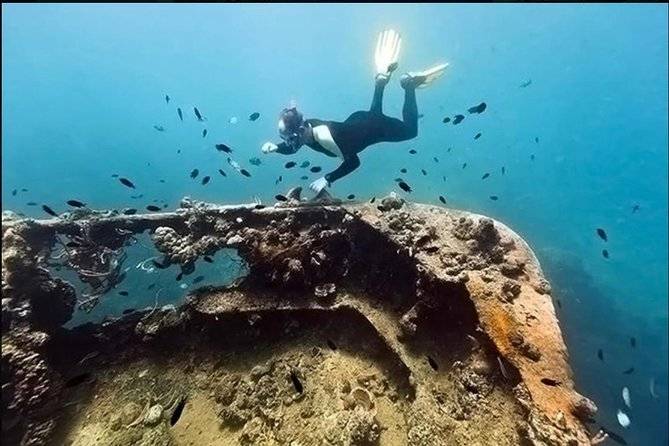 scuba diver at underwater wreck