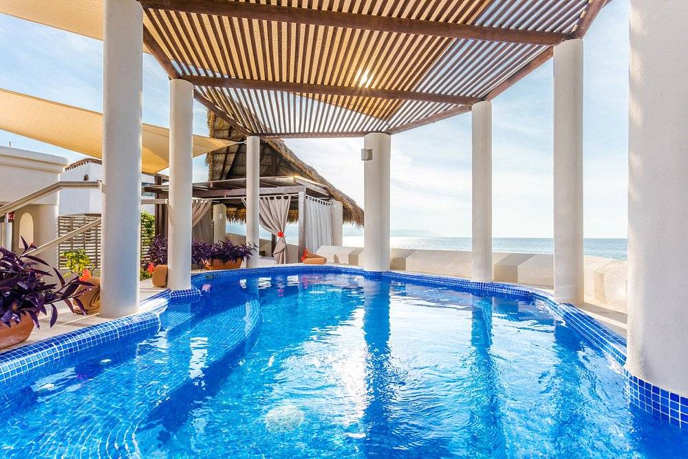 private covered resort pool lined with pillars