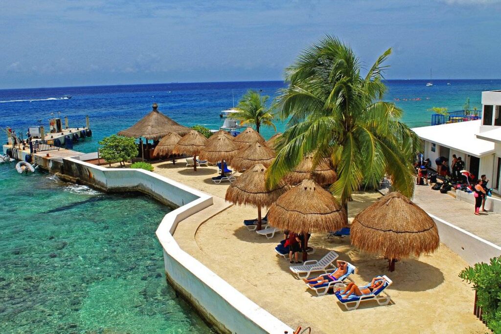 thatched umbrellas at ocean
