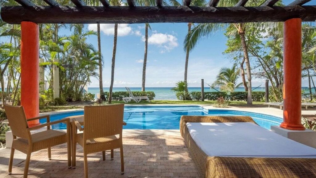 covered patio with a pool