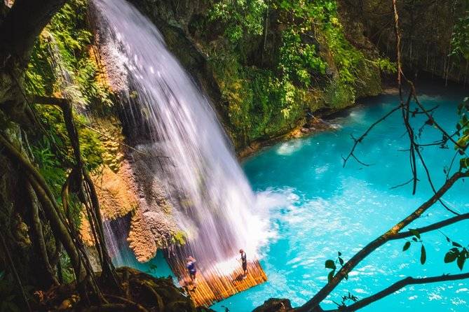 waterfall into aqua blue pool