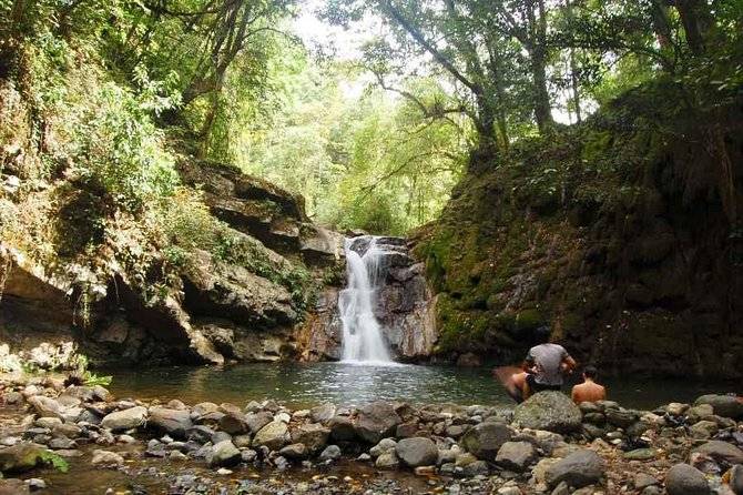 small waterfall flowing into pool