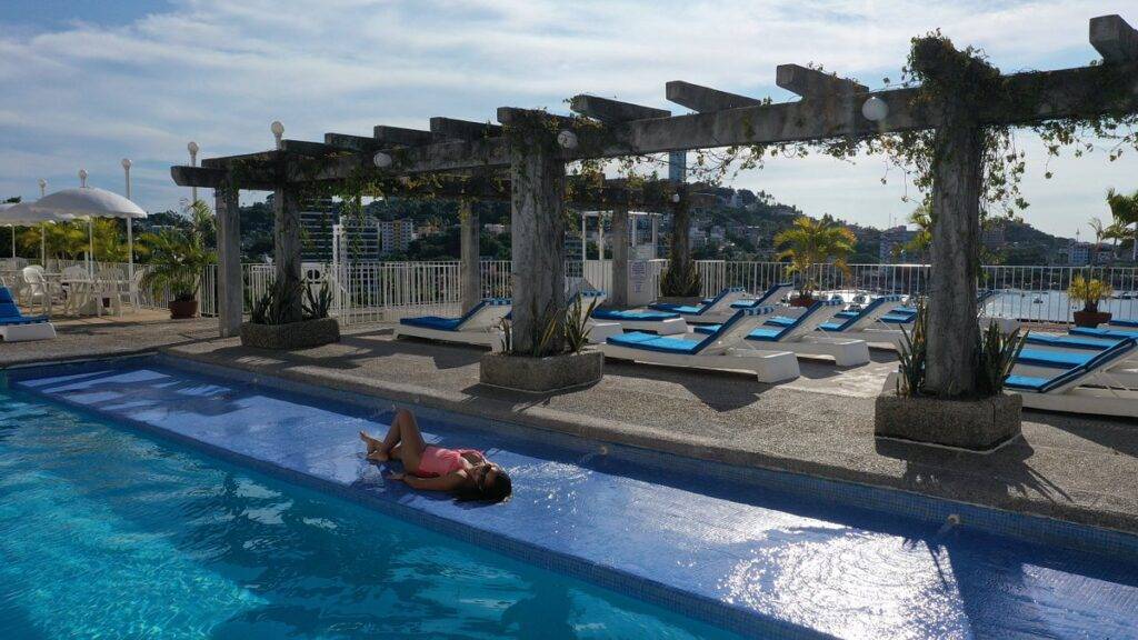 woman lying in resort pool