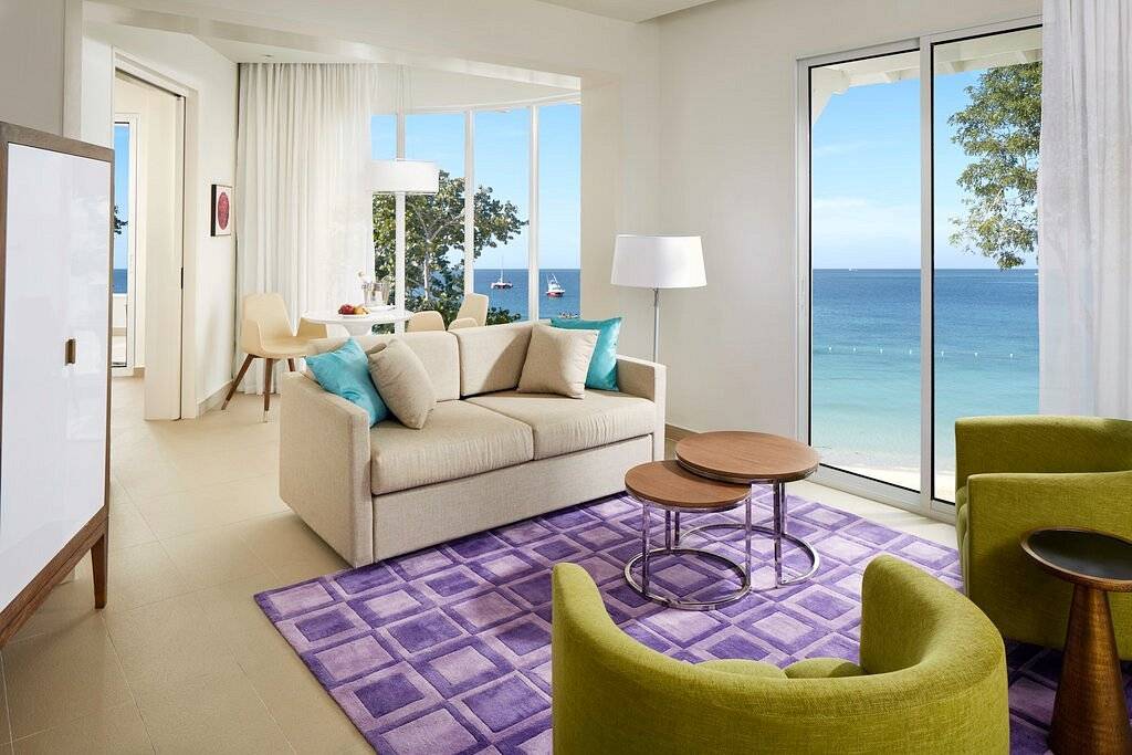 resort living room with windows looking onto ocean