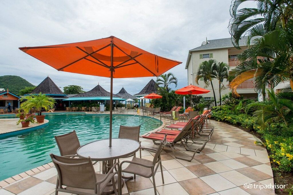 table with orange umbrella and chairs
