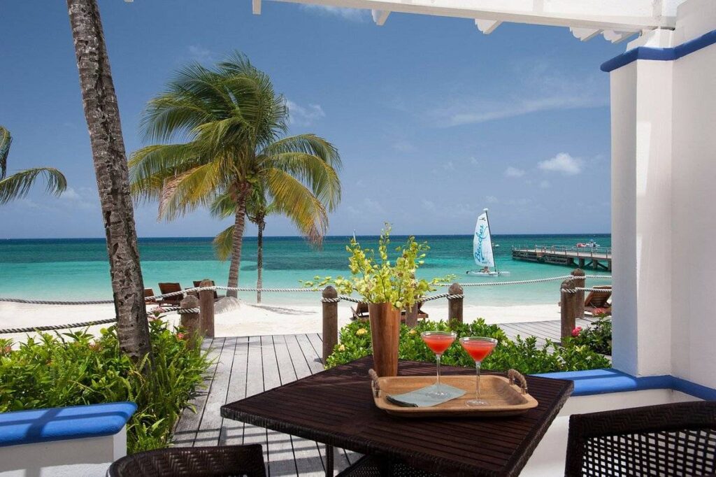 red drinks on table at the beach
