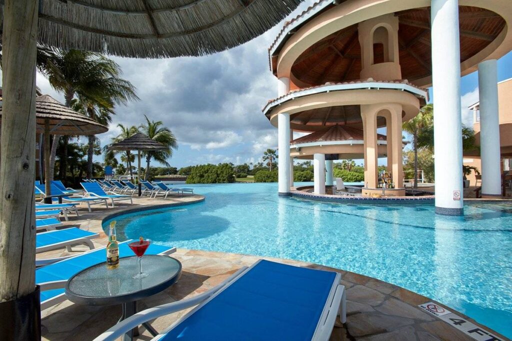 resort pool with lounge chairs