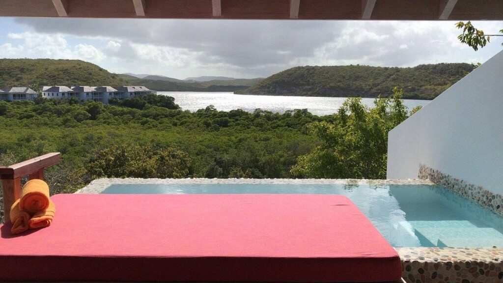 infinity pool with red bed
