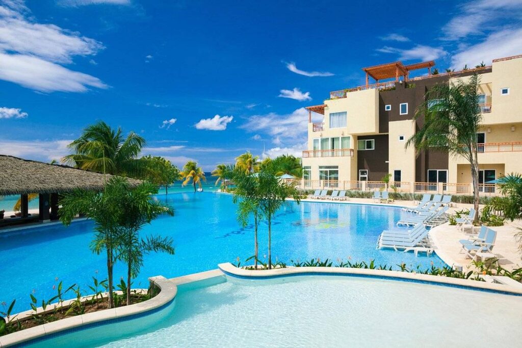 very large resort pool with building on the side
