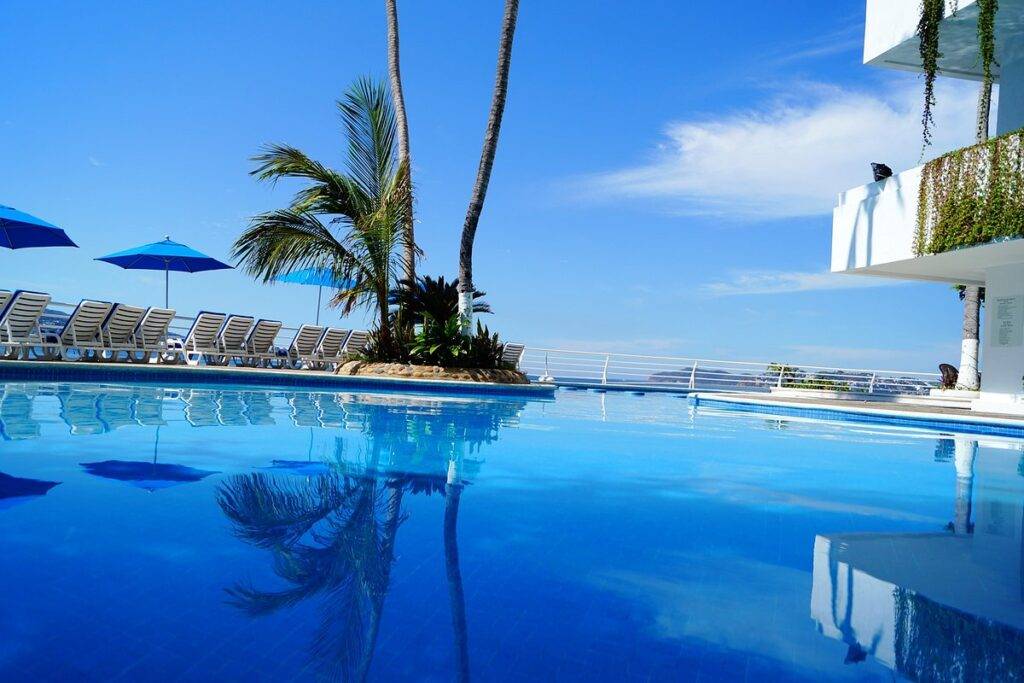resort pool with palm trees